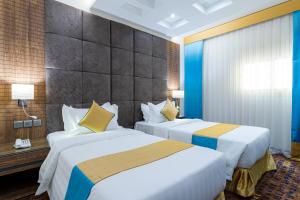 Кровать или кровати в номере Y Platinum Hotel