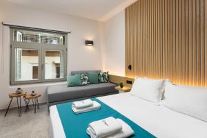 Ένα ή περισσότερα κρεβάτια σε δωμάτιο στο Lignum Suites Chania
