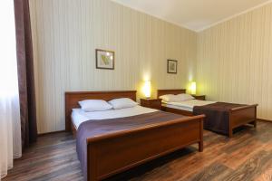 Postel nebo postele na pokoji v ubytování Hotel Persona