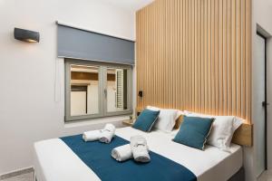 Ένα ή περισσότερα κρεβάτια σε δωμάτιο στο Lignum Suites Chania