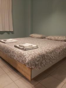 Postel nebo postele na pokoji v ubytování COCO Apartments
