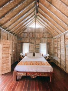 Postel nebo postele na pokoji v ubytování Umah Kayu Ubud