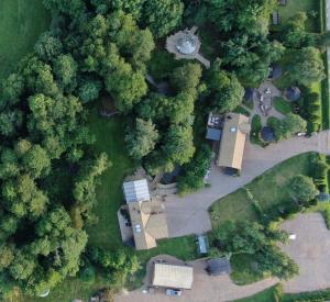an overhead view of a park with trees and a house at Bäverli Hills in Lidköping