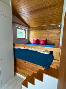 a small bedroom in a tiny house at Herzstück in Todtnauberg