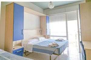 En eller flere senge i et værelse på Hotel Tropical + 20 billeder