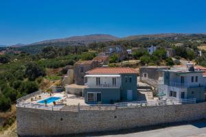 an aerial view of a house on a wall at Haravgi 3 Bedrooms Villa in Agia Triada