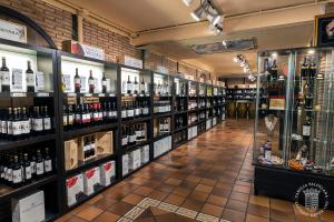 a store filled with lots of bottles of wine at Agroturismo Valdelana in Elciego