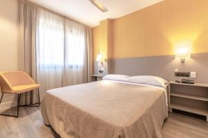 Postel nebo postele na pokoji v ubytování Hotel Zeus
