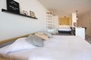 Letto o letti in una camera di Ostend Studio