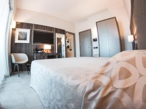 Voodi või voodid majutusasutuse Hotel Kuma toas