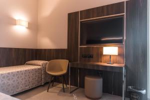 Voodi või voodid majutusasutuse Hotel Kuma toas