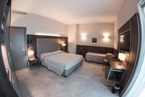 Voodi või voodid majutusasutuse Hotel Kuma toas