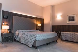 Voodi või voodid majutusasutuse Hotel Kuma toas