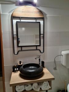 Koupelna v ubytování Zorilor Cactus Apartment + 7 fotografií