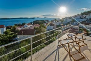 a view from the balcony of a house with a view of the ocean at Villa Lucija in Hvar