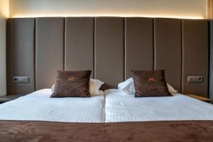Uma cama ou camas num quarto em Hotel Central