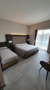 Voodi või voodid majutusasutuse Hotel Kuma toas