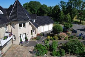 an aerial view of a house with a garden at Pension Wortmann in Bad Laer