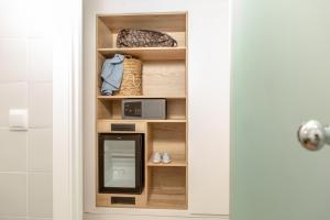 a medicine cabinet with a mirror in a bathroom at RVHotels Nieves Mar in L'Escala