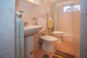 Koupelna v ubytování Apartments Garbina + 47 fotografií