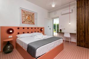 Postel nebo postele na pokoji v ubytování Maison Di Fiore B&B