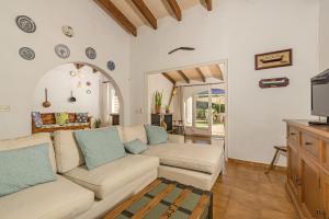 A television and/or entertainment centre at Villa Es Mirador de ses Altines
