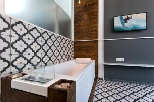 TV a/nebo společenská místnost v ubytování Maison Di Fiore B&B