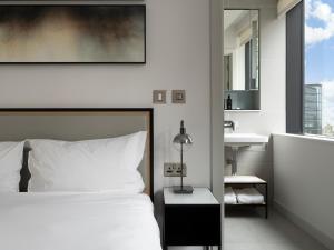 CitySuites Aparthotel客房内的一张或多张床位