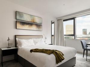 CitySuites Aparthotel客房内的一张或多张床位