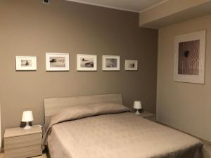 A bed or beds in a room at La Porta Nel Giardino