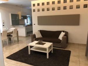 A kitchen or kitchenette at La Porta Nel Giardino