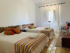 Postel nebo postele na pokoji v ubytování Dona Maria 66 + 34 fotografií