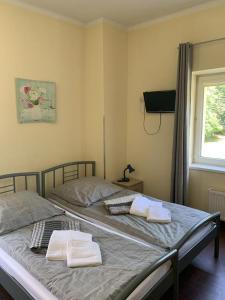 Cama ou camas em um quarto em Aleksander