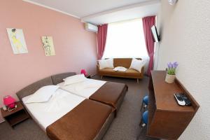 Postel nebo postele na pokoji v ubytování Hotel Victoria + 37 fotografií
