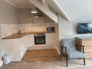 Η κουζίνα ή μικρή κουζίνα στο Braemar +31 φωτογραφίες