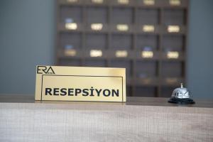 a sign that says raa registration on a table at The Era Otel in Gölhisar