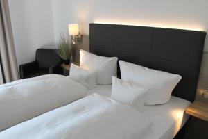 Postel nebo postele na pokoji v ubytování Hotel Krone