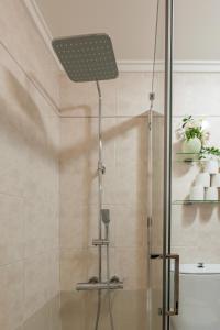 a shower with a glass door in a bathroom at Nafarroa - BasKey rentals in Zarautz