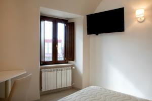 TV a/nebo společenská místnost v ubytování Residenza Cappelli - Affittacamere