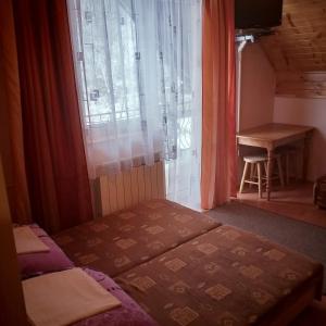 Posteľ alebo postele v izbe v ubytovaní Kwatery pod Doliną