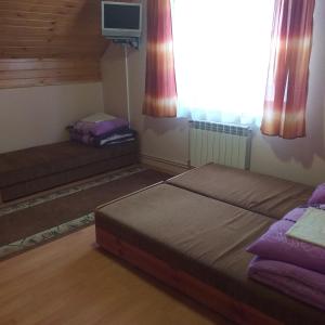 Posteľ alebo postele v izbe v ubytovaní Kwatery pod Doliną