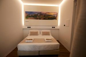 Łóżko lub łóżka w pokoju w obiekcie Orizzonte MHotel