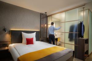 Letto o letti in una camera di Hetzel Hotel Stuttgart