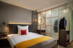 Letto o letti in una camera di Hetzel Hotel Stuttgart