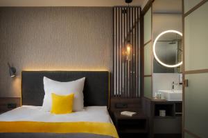 Letto o letti in una camera di Hetzel Hotel Stuttgart