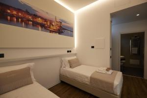 Postel nebo postele na pokoji v ubytování Orizzonte MHotel