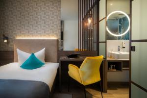 Letto o letti in una camera di Hetzel Hotel Stuttgart