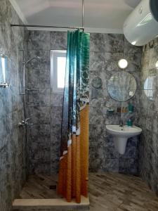 a bathroom with a shower and a sink at La MER 2 in Tsarevo +76 photos