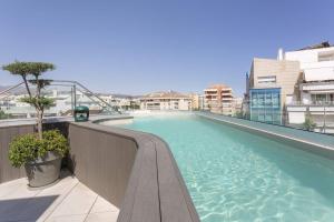 a large swimming pool on top of a building at Hotel Lima - Adults Recommended in Marbella