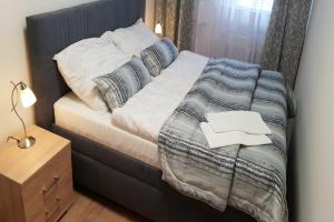 Postel nebo postele na pokoji v ubytování Apartmány Poslův Mlýn